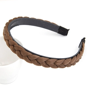 Detail of dark brown braided hair headband with non-slip inner teeth on white background
