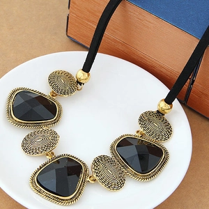Bohemian oversized crystal pendant necklace with black faceted stones in golden frames