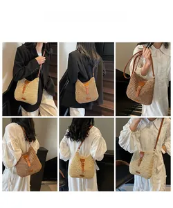 Crossbody straw bag with leather strap shown in cream and tan colors on a model