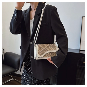 Detail of white leather crossbody bag with vintage mountain and wave oriental prints