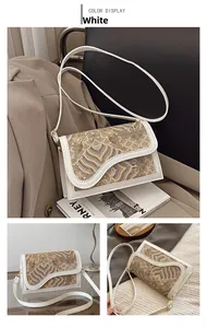Detail of Chinese style crossbody bag with wave embroidery and gold metal hardware