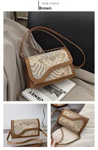 Detail view of brown crossbody bag with traditional wave embroidery and interior layout