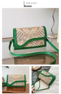 Close-up of green crossbody bag featuring traditional Chinese embroidery and cloud patterns