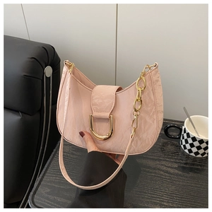 Detail of light pink crescent bag with pleated silk texture and golden D-buckle hardware
