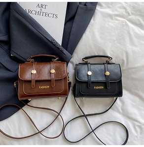 Detail of vintage oil-wax PU leather mini crossbody bags in dark brown and black