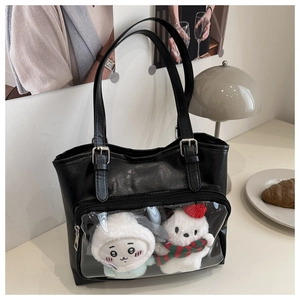 Detail view of black Itabag tote with clear PVC pocket for plush toy display