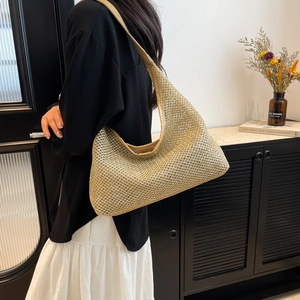 Fashionable woven hobo shoulder bag with large capacity in a stylish beige gold finish