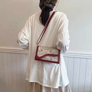 Ethnic embroidery crossbody bag with vintage cloud pattern and red leather trim for women