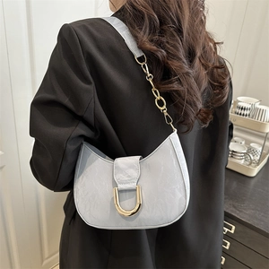 Light blue half-moon shoulder bag with rock texture and golden D-buckle detail