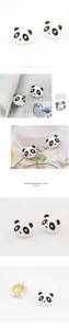 Détail de boucles d'oreilles panda avec émail noir et blanc et yeux en cristal étincelants