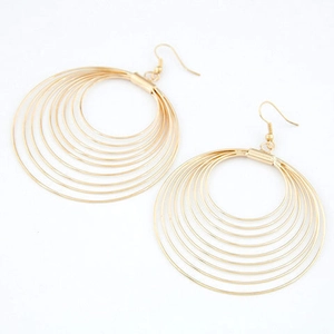 Detail of gold multi-layered hoop earrings with eight tiered circles and hook style