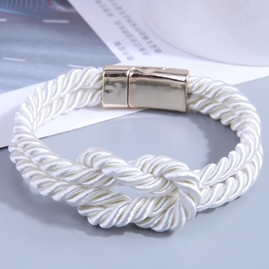 White woven rope bracelet featuring a polished gold magnetic clasp and nautical knot