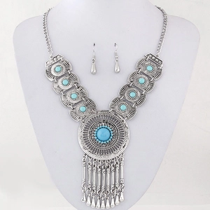 Vintage bohemian jewelry set with blue turquoise teardrop pendants and fringe