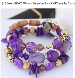 Close-up of bohemian layered bracelet with purple marble beads and crystal accents