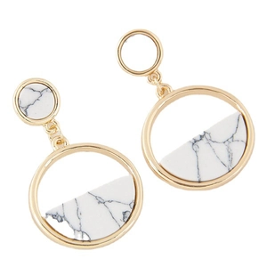 Minimalist gold metal circle earrings with white marble resin inlay in a geometric drop style