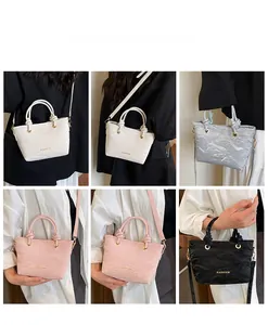 Detail view of retro crossbody bucket bags in four colors with glossy wrinkled texture