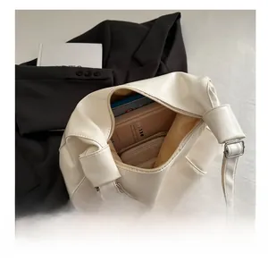 Top view of spacious cream PU leather tote bag showing large interior storage capacity