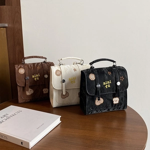 Three retro textured tote bags with cute embroidery in brown, white and black colors