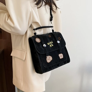 Classic black nylon crossbody bag with cute bear embroidery and silver buckles
