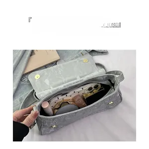 Detailed internal view of grey marble pattern baguette bag showing spacious storage capacity