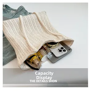 Overhead view showing large capacity of woven straw tote bag with daily essentials