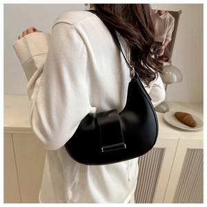 Chic black crescent underarm bag in smooth PU leather with stylish metal buckle detail