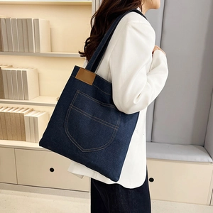 Large capacity dark blue denim tote bag for women with shoulder strap and front pocket