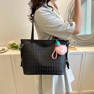 Large black woven PU leather tote bag with pink plush charm on shoulder for daily commute