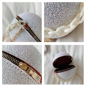 Macro shot of circular evening bag with iridescent white sequins and dual chain straps