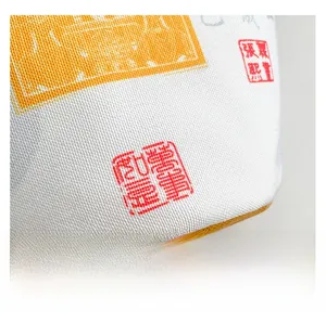 Macro shot of high-quality canvas fabric with red Chinese seal and woven texture