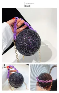Detail of black spherical evening bag with sequins, purple chain, and gold shoulder strap