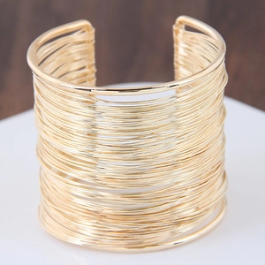 Exaggerated geometric open cuff bracelet with multilayer gold wire wrapping design