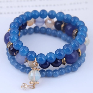 Bohemian multi-layer beaded bracelet with blue crystals and gold elephant charms