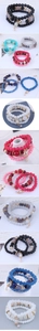 Detail of bohemian multilayer beaded bracelets with colorful stones and charms