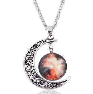 Detailed close-up of retro silver hollow moon necklace with galaxy nebula pendant