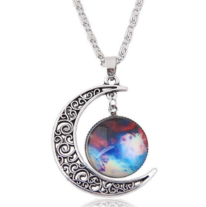 Detailed view of silver hollow moon pendant with nebula glass gem and silver chain