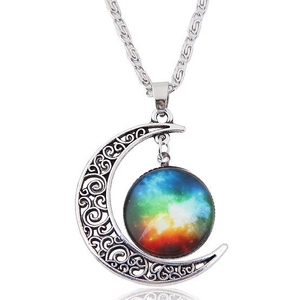 Detailed view of vintage silver hollow moon pendant with a colorful nebula galaxy stone