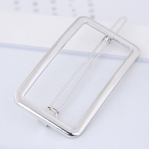 Detailed view of polished silver metal rectangular hollow hair clip with a sleek finish