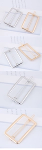 Detail of minimalist rectangular metal hair clips in gold and silver finishes