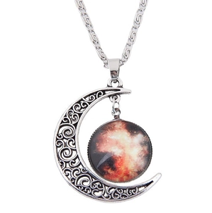 Retro silver crescent moon necklace with hollow patterns and celestial galaxy pendant