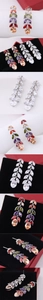 Detailed views of leaf-shaped tassel earrings with colorful marquise-cut zircon stones
