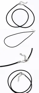 Detail of minimalist black leather cord necklace with silver lobster clasp and extension chain