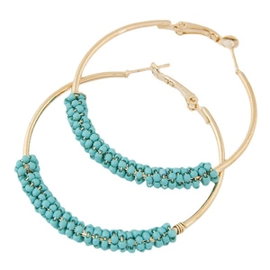 Chic gold hoop earrings with turquoise seed beads in a bohemian style design