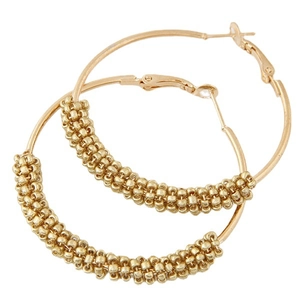 Classic gold beaded hoop earrings with bohemian woven texture on a white background