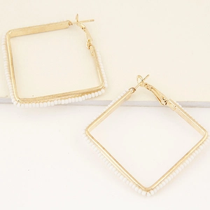 Minimalist gold square hoop earrings with white seed beads and secure latch back closure