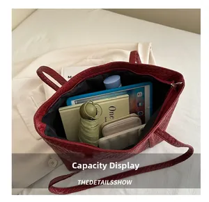 Top view of spacious woven tote bag showing internal storage for tablets and essentials