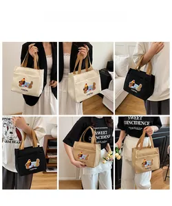 Détails des sacs fourre-tout en toile avec broderie de chien en beige noir et kaki