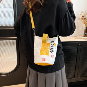Traditional Chinese style bucket bag with red calligraphy pattern and yellow straps