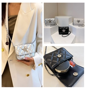 Close-up of quilted mini bag with sparkling star charm and metal chain shoulder strap