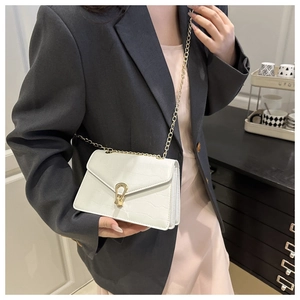 White faux leather chain bag with croc-embossed texture and golden horseshoe buckle